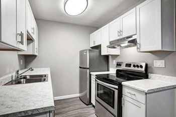 White kitchen cabinetry with modern pulls