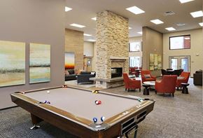 Arlington apartment for rent - Apartments for Rent in Arlington - Cedar Pointe - Game Room with a Pool Table, a Fireplace, and Various Comfortable Seating Options
