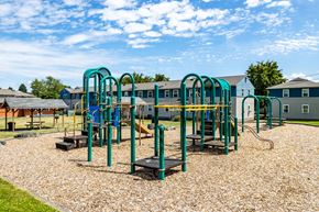 Seattle apartment for rent - A playground with a slide, swings, and a seesaw.at Lake Washington Apartments, Seattle, 98118