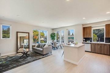 Menlo Park apartment for rent - a large living room with a kitchen and a table
