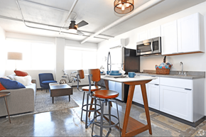 Reno apartment for rent - A kitchen with a table and chairs in the middle of the room at LOFT 205 Apartments, Reno