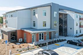 Davis apartment for rent - a new apartment building with cars parked in front of it