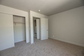 Davis apartment for rent - a bedroom with two closets and a carpeted floor
