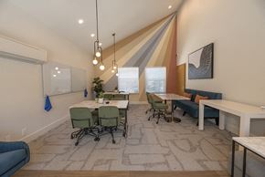 Davis apartment for rent - a room with a long table with chairs and a couch