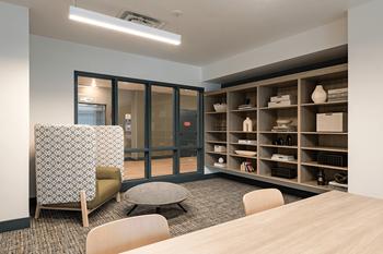 A room filled with furniture and a large window