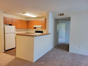 Fairfield apartment for rent - Full size kitchen overlooking living area at DOVER WOODS SENIOR APARTMENTS, California, 94533