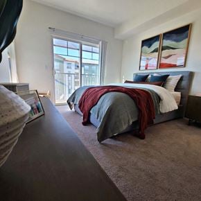 Dublin apartment for rent - a bedroom with a bed and a large window