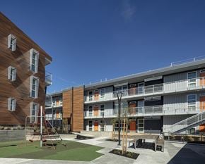 Vacaville apartment for rent - a view of the courtyard and balconies of an apartment complex at ROCKY HILL VETERANS HOUSING, VACAVILLE, CA