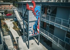 Vacaville apartment for rent - a large mural of a red and blue bird on the side of a building at ROCKY HILL VETERANS HOUSING, VACAVILLE, 95688 