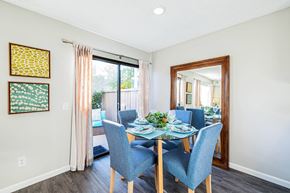 Lake Forest apartment for rent - a dining room with a glass table and chairs at SERRANO HIGHLANDS APARTMENT HOMES, Lake Forest, 92630-7006