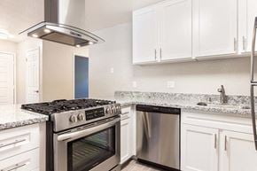 Ukiah apartment for rent - Kitchen with white cabinets and appliances