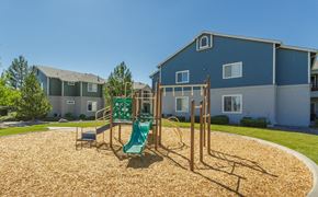 Reno apartment for rent - Stead, NV Apartments - Sky Vista Commons - Playground with Slide, Woodchucks, and Manicured Lawn