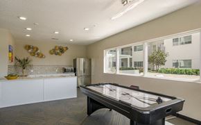 Sparks apartment for rent - a game room with a pool table and a kitchen