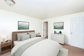 Portland apartment for rent - Two-Bedroom Apartments in Gresham, OR- Township Eastside- Large Bed with White Dresser and Wall-to-Wall Carpeting at Township Eastside, Portland, 97236