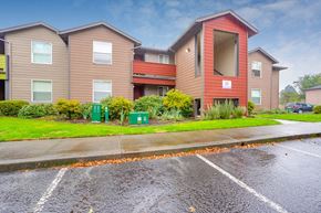 Canby apartment for rent - Exterior view of building with parking at TOWNSHIP Apartments, CANBY, Oregon