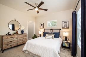 Sparks apartment for rent - Sparks Apartments - High Rock 5300 - Oversized Bedroom with Carpeted Floors, Modern Ceiling Fan, Large Window, and Queen Bed