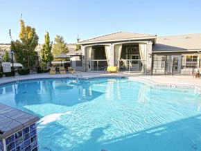 Sparks apartment for rent - Sparks NV Apartments - High Rock 5300 - Relaxing Pool with Lounge Seating, Umbrellas, and Clubhouse