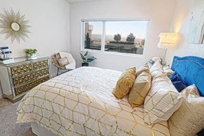 Sparks apartment for rent - Two-Bedroom Apartments in Sparks, NV- Deco at Victorian Square- Large Window with Mirror Drawers and Comfortable Bed
