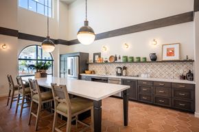 Camarillo apartment for rent - a kitchen with a white table and chairs and a counter top at Vintage at Anacapa Canyon, California