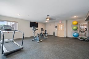 Reno apartment for rent - Gym with Tradmill, Stationary Bike Machines, Mats, Equipment, Large Window, Ceiling Fan, and TV at VINTAGE AT CITI VISTA, Nevada