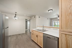 Laughlin apartment for rent - A kitchen with a dishwasher and a refrigerator at VISTA CREEK Apartments, Laughlin, NV 89029