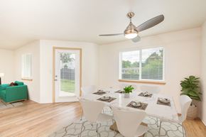 Vancouver apartment for rent - A dining room with a table set for six and a ceiling fan.at Vancouver Mall Apartments, Vancouver Washington