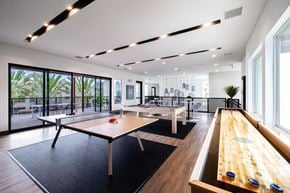 Las Vegas apartment for rent - a game room with ping pong tables and a pool table at BASE APARTMENT HOMES, LAS VEGAS, NV