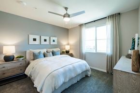 Las Vegas apartment for rent - a bedroom with a bed and a ceiling fan at BASE APARTMENT HOMES, LAS VEGAS, Nevada