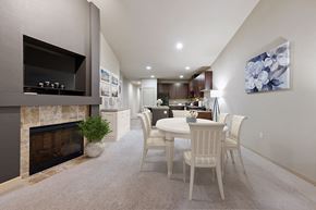 Olympia apartment for rent - Olympia Apartments for Rent- Yauger Park Vilas- White Dining Room Table and Chairs, Fireplace, and a Flower Wall Painting
