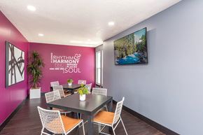Roy apartment for rent - a dining room with a table and chairs and a pink wall at Cadence Apartments, Roy Utah