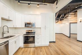 Fairview apartment for rent - A modern kitchen with white cabinets and stainless steel appliances.at Fairview Village Homes, Fairview