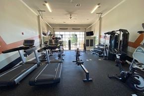 Oklahoma City apartment for rent - Fitness room with cardio and weight equipment