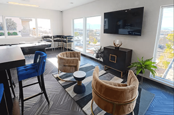 Clubroom with seating, tv, shuffleboard, and wifi