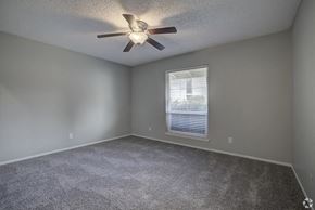 Sacramento apartment for rent - an empty room with a ceiling fan and a window