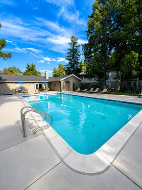Tracy apartment for rent - A swimming pool with a slide and a house in the background.