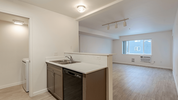 Coeur D'alene apartment for rent - A kitchen with a white counter top and a window.