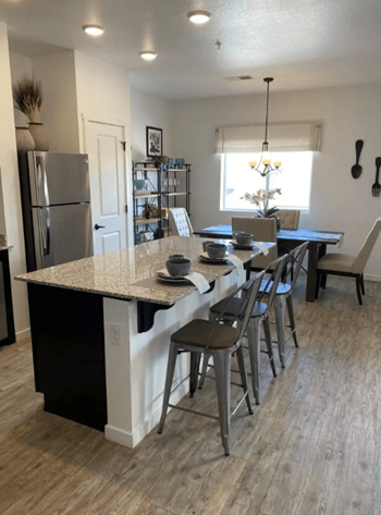 Luxury simulated hardwood plank at entry, kitchen, laundry and baths