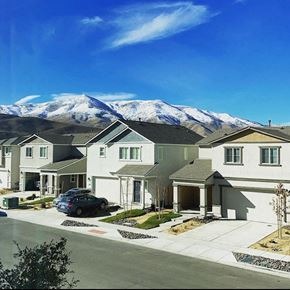 Reno apartment for rent - a row of houses with mountains in the background