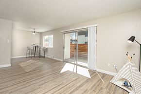 Rohnert Park apartment for rent - Apartments near Sonoma State University - The Lenox - Open Plan Living Room with Breakfast Nook, Sliding Patio Doors, and Wood Plank Flooring