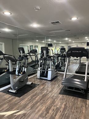 Chico apartment for rent - a gym with cardio machines and mirrors