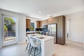 Menlo Park apartment for rent - a kitchen with a large center island next to a sliding glass door