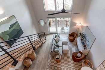 Overhead view of a living room with a staircase