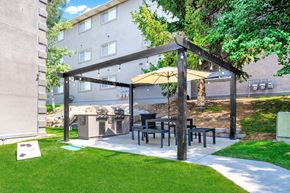 Orem apartment for rent - a patio with a table and chairs under a canopy at Mountain Run Apartments, Orem, 84058