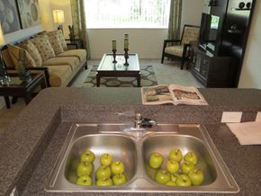 Jacksonville apartment for rent - Mission  Pointe apartment home  kitchen overlooking living area at Mission Pointe Apartments, Jacksonville, Florida