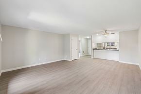 Canby apartment for rent - A spacious room with light wood flooring and white walls.