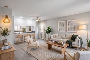 Canby apartment for rent - A living room with a sofa, chairs, and a coffee table.