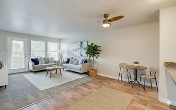 Canby apartment for rent - A living room with a grey rug and a wooden coffee table.