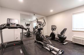 Bend apartment for rent - A well-equipped gym with treadmills, elliptical machines, and other exercise equipment.