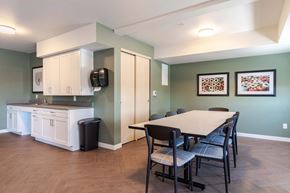 Bend apartment for rent - A kitchen with a table and chairs in the middle of the room.