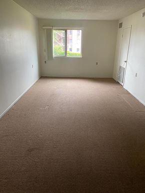 Los Angeles apartment for rent - a room with a carpeted floor and a window